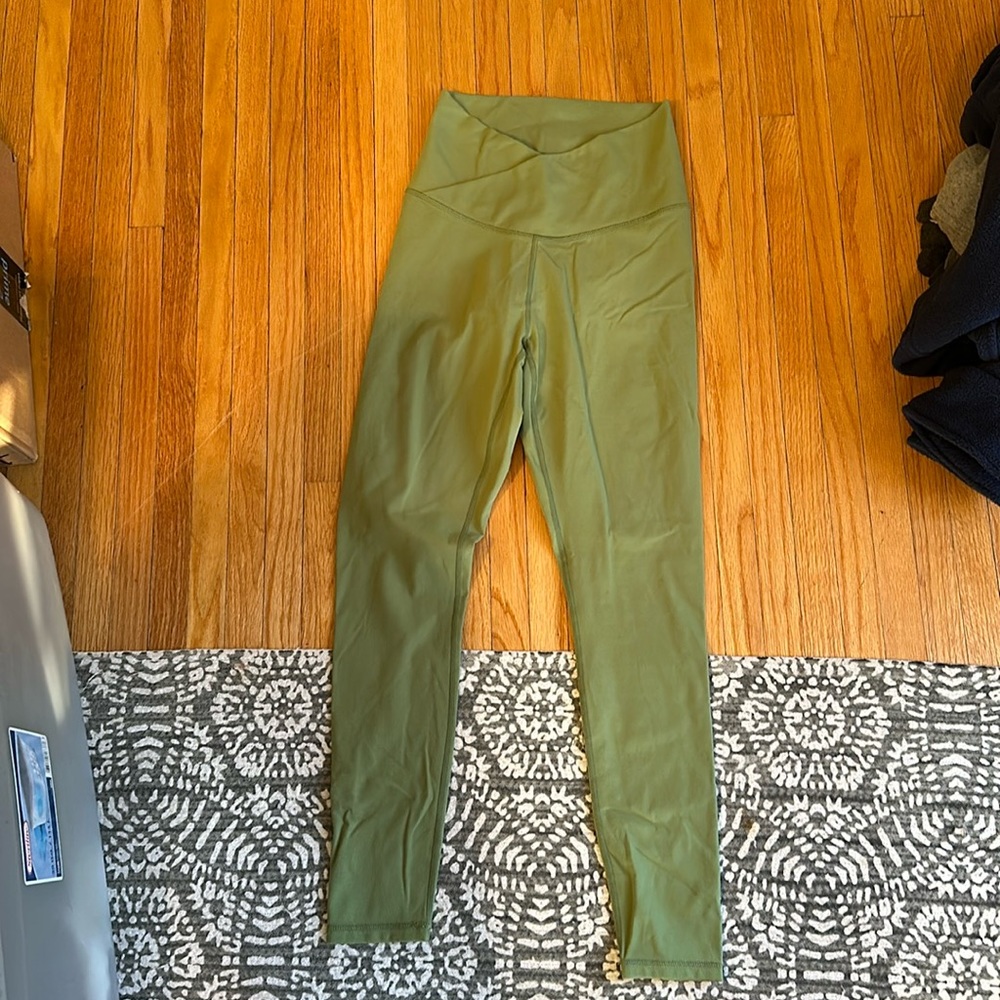 New Paragon workout leggings with cross front, worn once, light/bright green